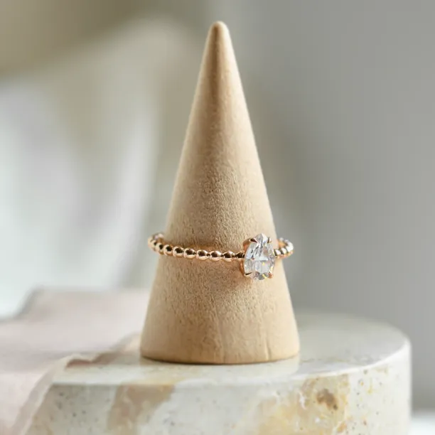 Gold engagement ring with beaded ball setting and pear moissanite BEAU Image