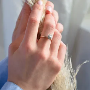 AUDREY gold ring with pavé moissanites worn on a finger