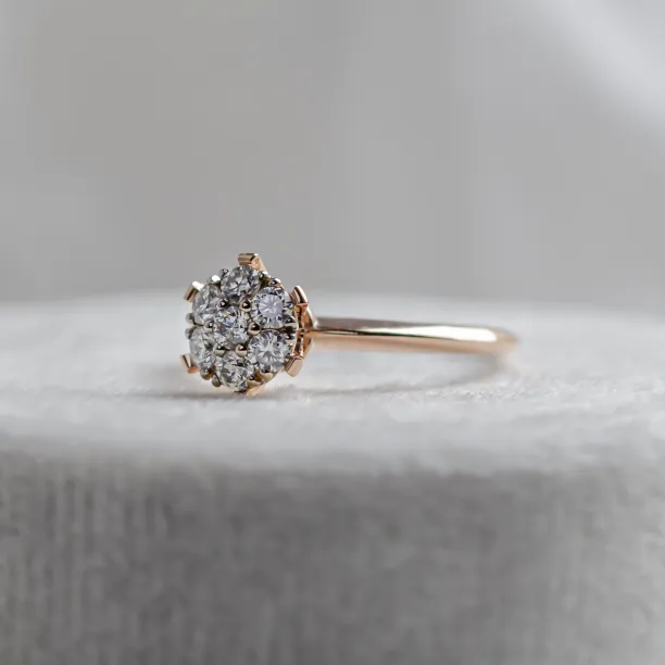 Angled close-up of the AUDREY gold ring with pavé moissanites