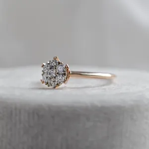 Angled close-up of the AUDREY gold ring with pavé moissanites