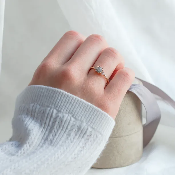 BOOGIE gold engagement ring with pavé moissanites worn on the hand