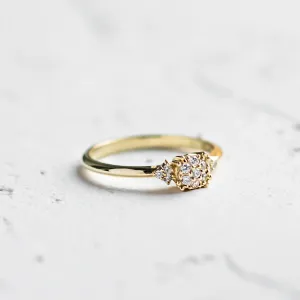 Angled view of the BOOGIE gold engagement ring with pavé moissanites