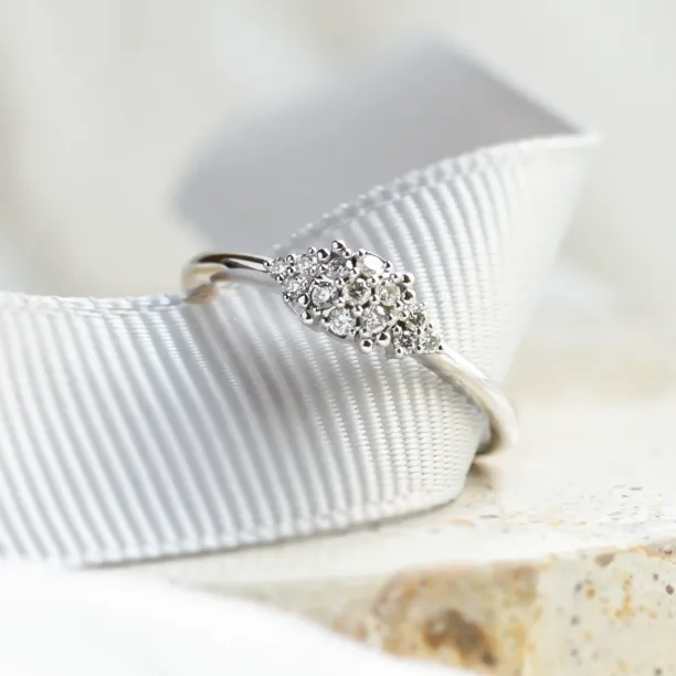 Close-up of the pavé moissanite setting on the BOOGIE gold engagement ring