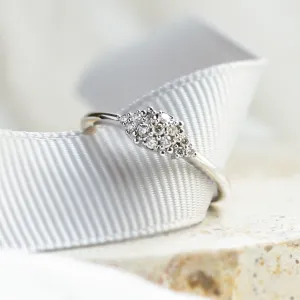 Close-up of the pavé moissanite setting on the BOOGIE gold engagement ring