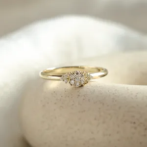 Angled view of the BOOGIE gold engagement ring with pavé moissanites