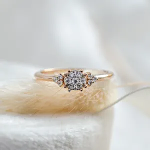 Close-up of the BOOGIE gold engagement ring and its pavé moissanite cluster