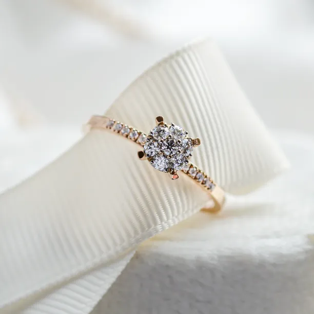 Angled close-up of the LOLA pavé gold ring with moissanites