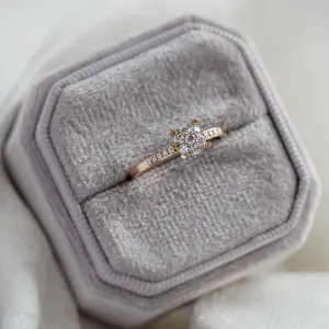 Pavé gold ring with moissanites shown from above