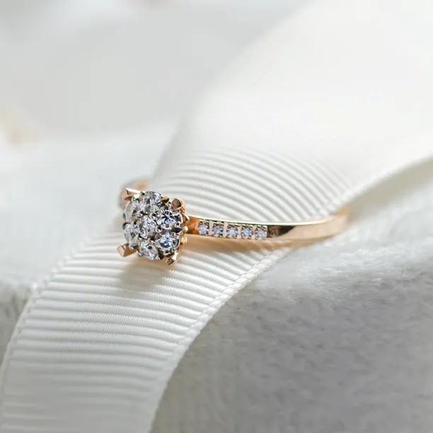 Angled close-up of the LOLA pavé gold ring with moissanites