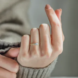 BOWIE pavé engagement ring with moissanites worn on a finger