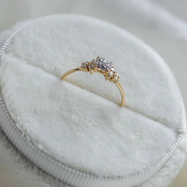 Angled view of the moissanite cluster on the BOWIE engagement ring