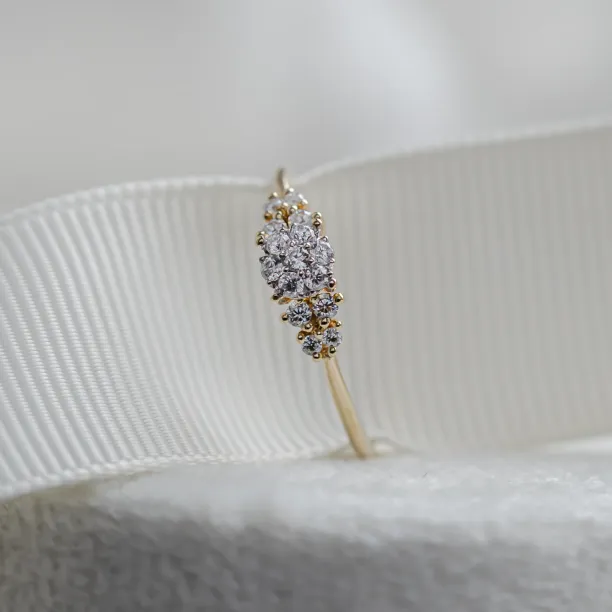 Close-up of BOWIE pavé engagement ring with moissanites