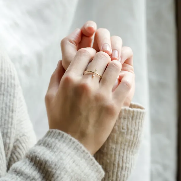 PERCY minimalist moissanite ring with baguette moissanite worn on a hand