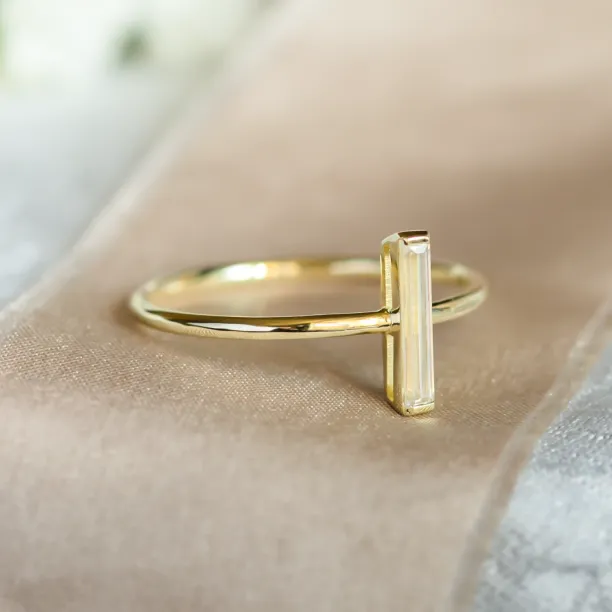 Angled close-up of the PERCY ring with a baguette moissanite