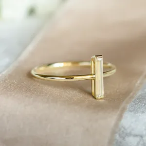 Angled close-up of the PERCY ring with a baguette moissanite