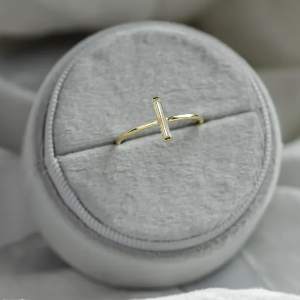 Angled view of the minimalist PERCY ring with baguette moissanite