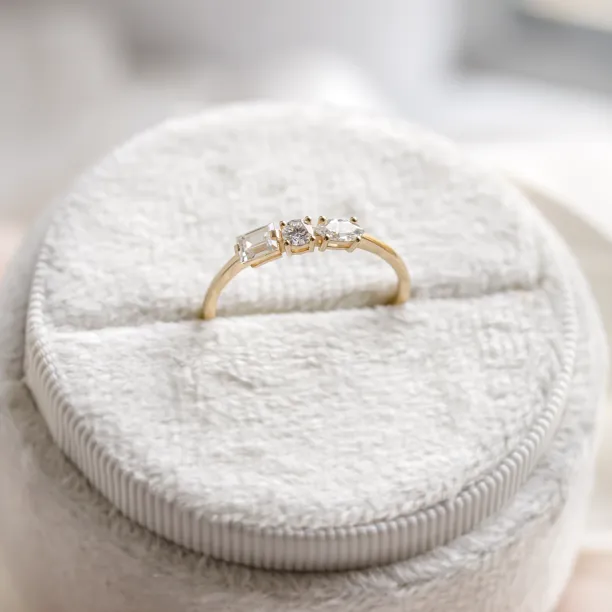 AVELA gold ring with three lab-grown diamonds shown upright