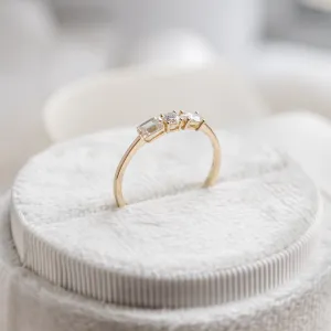 AVELA gold ring with three lab-grown diamonds, angled view