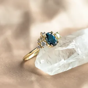 Angled view of the VAIANA gold ring with blue and white lab-grown diamonds
