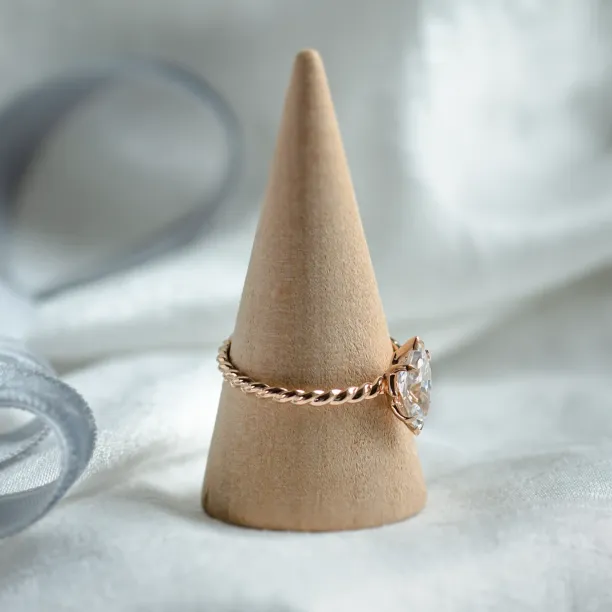 Angled view of the DAHLIA twisted rope ring with marquise-cut moissanite
