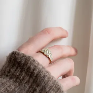 Lab grown diamond cluster ring worn on a hand, side view