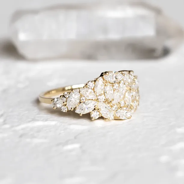 Angled close-up of the gold VALENTINA moissanite cluster ring