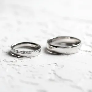 TRADITIO diamond wedding rings shown separately in a clear view