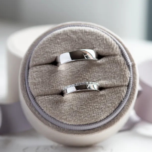 TRADITIO wedding ring pair displayed together, including the diamond-accented ring