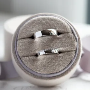 TRADITIO wedding ring pair displayed together, including the diamond-accented ring