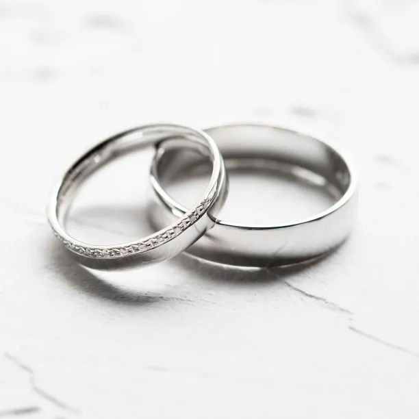 Close-up of TRADITIO diamond wedding rings arranged together