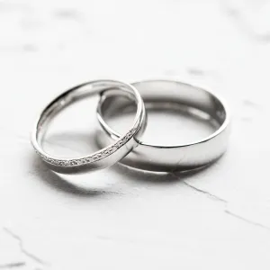 Close-up of TRADITIO diamond wedding rings arranged together