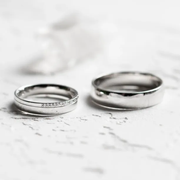 TRADITIO diamond wedding rings shown side by side