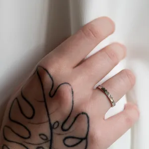 Diamond-set TRADIZIONE wedding ring worn on a hand