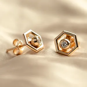 Angled view of SAM gold hexagonal earrings with lab-grown diamonds