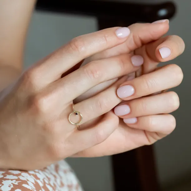 Red garnet MERIDAL ring worn on the hand