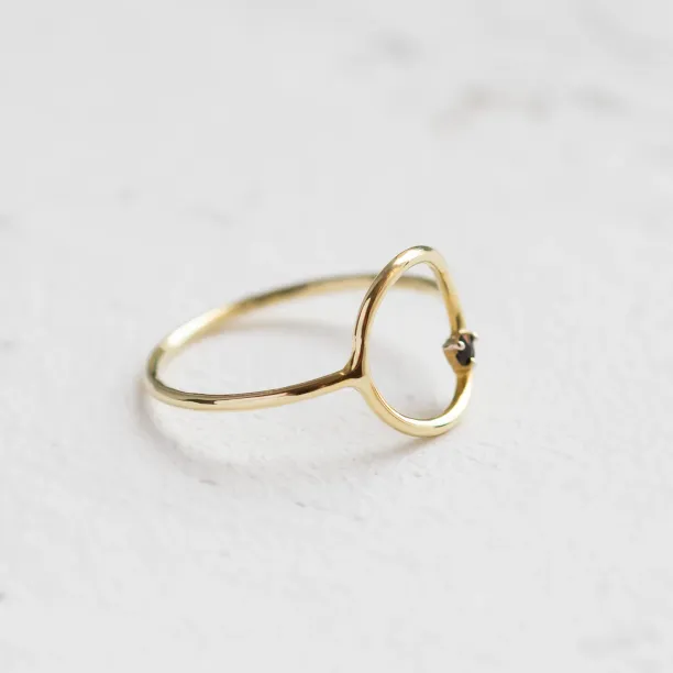 Angled view of the minimalist red garnet MERIDAL ring