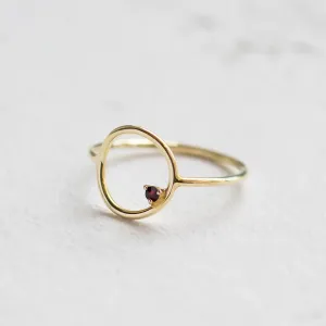 Close-up angled view of the red garnet MERIDAL ring