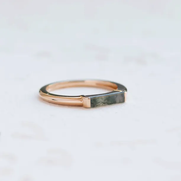 Gold CATHIE ring with moss agate in an angled view