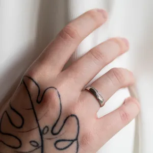 Diamond-set women's TRADITION wedding ring worn on a hand