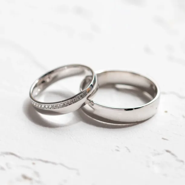 Angled view of TRADITION his and hers wedding rings