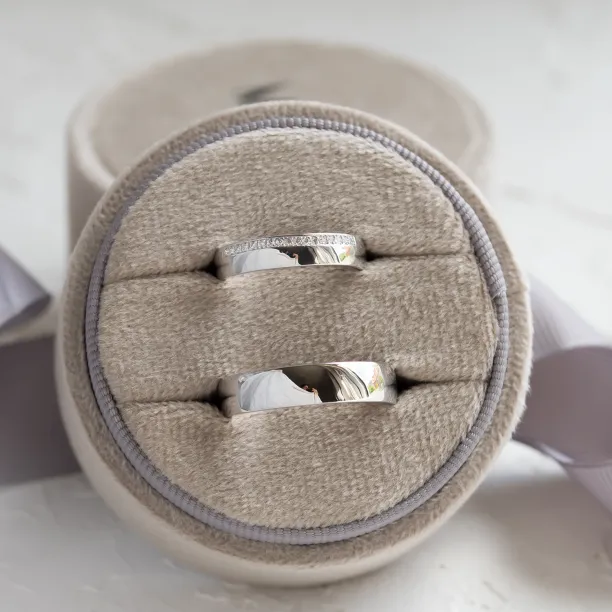 TRADITION wedding rings shown together, with diamonds on the women's ring