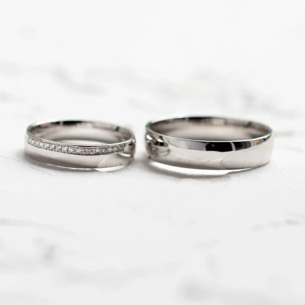 TRADITION wedding rings shown side by side, one diamond-set and one plain