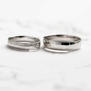 TRADITION wedding rings shown side by side, one diamond-set and one plain