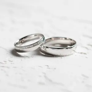 TRADITION his and hers wedding rings, including a diamond-set women's ring