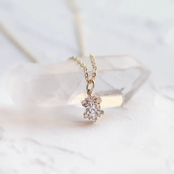 Close-up of the AMORIS gold necklace pendant with a lab-grown diamond
