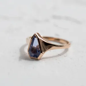 Angled view of the PLATON signet ring with faceted blue sapphire