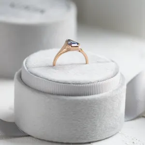 Side profile of the PLATON gold signet ring and blue sapphire