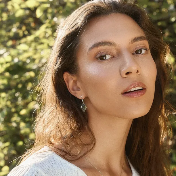 MARIBEL salt and pepper diamond earring worn on the ear