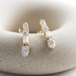 Angled view of the MARINA dangle moissanite earrings