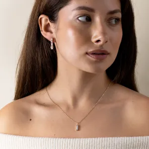 MARINA moissanite dangle earring worn on the ear